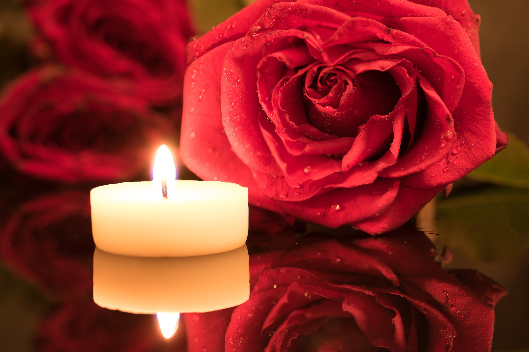 Candle and Red Roses